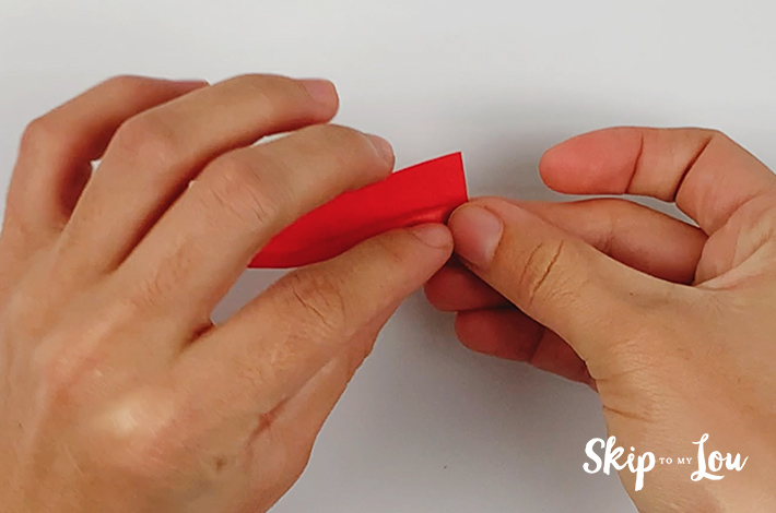 Two hands forming the first part of the petal.
