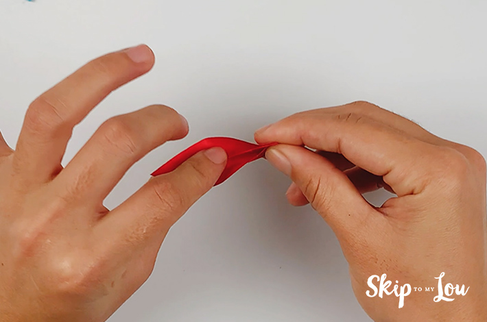 Two hands forming the next part of the petal.