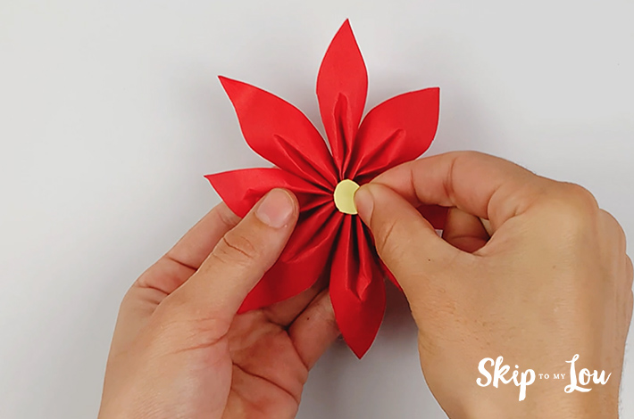 A paper dot forms the centre of the flower.