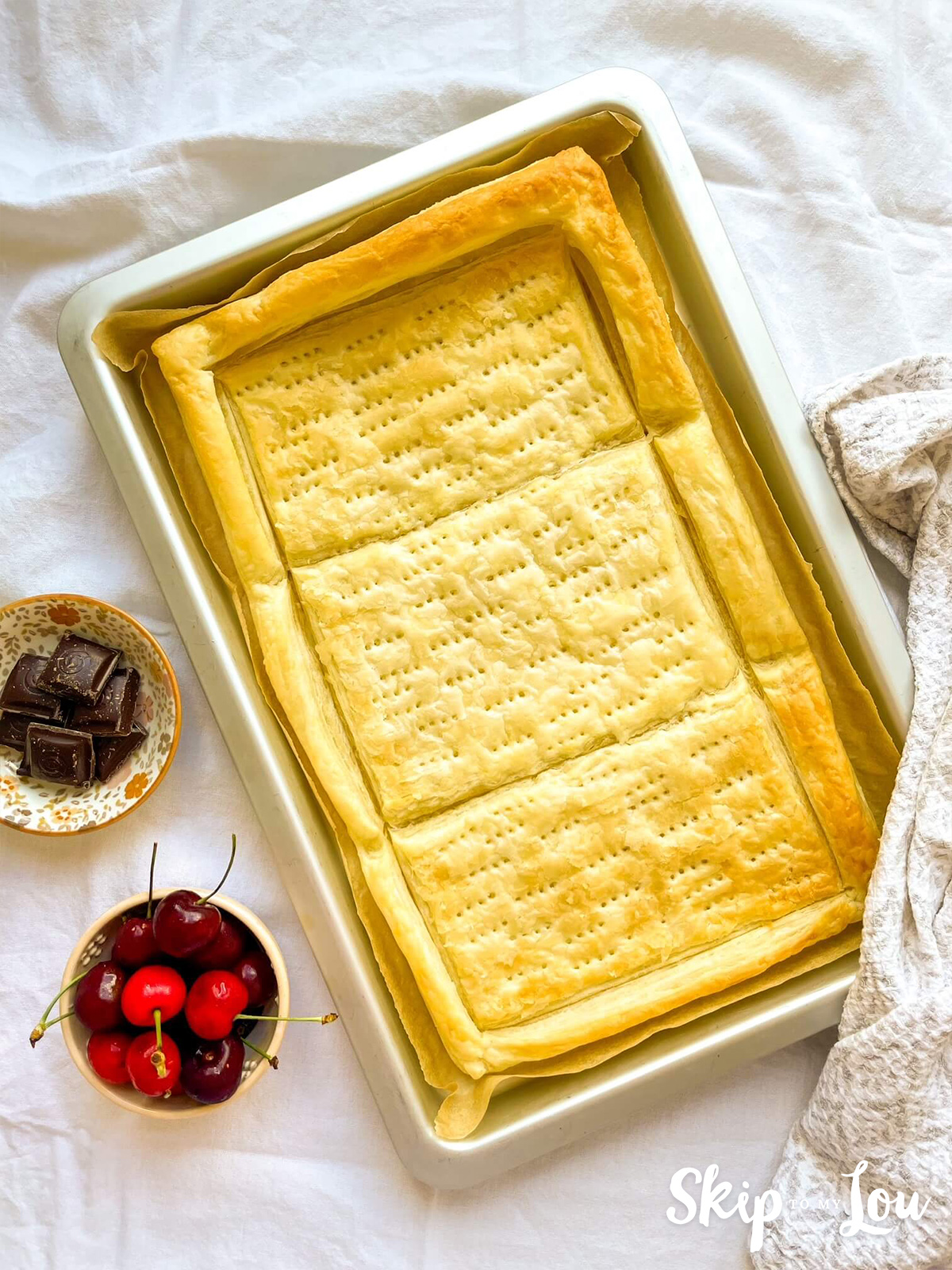 Baking tin and puff pastry fresh out the oven and baked golden brown. 