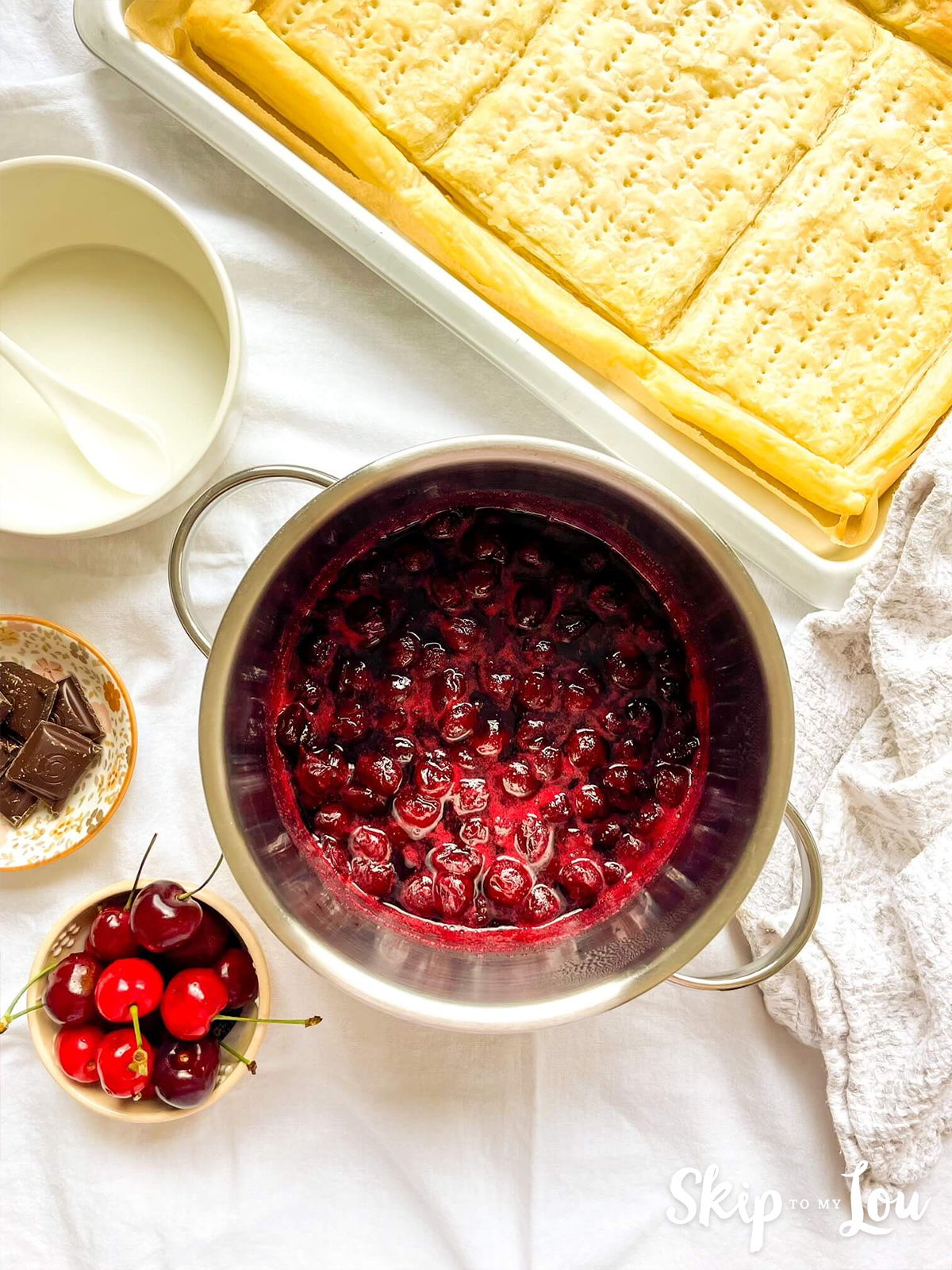 Cooked cherries in a saucepan. 