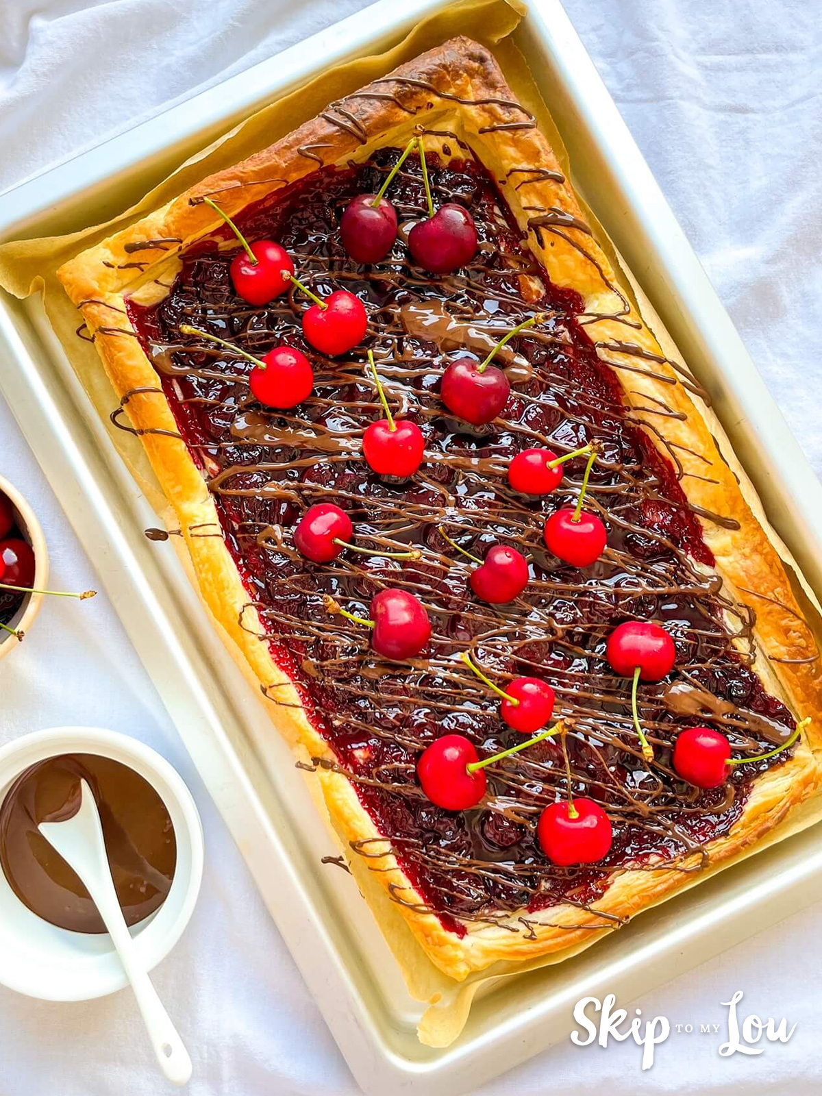 Fresh cherries added to the top of the tart, ready to serve.