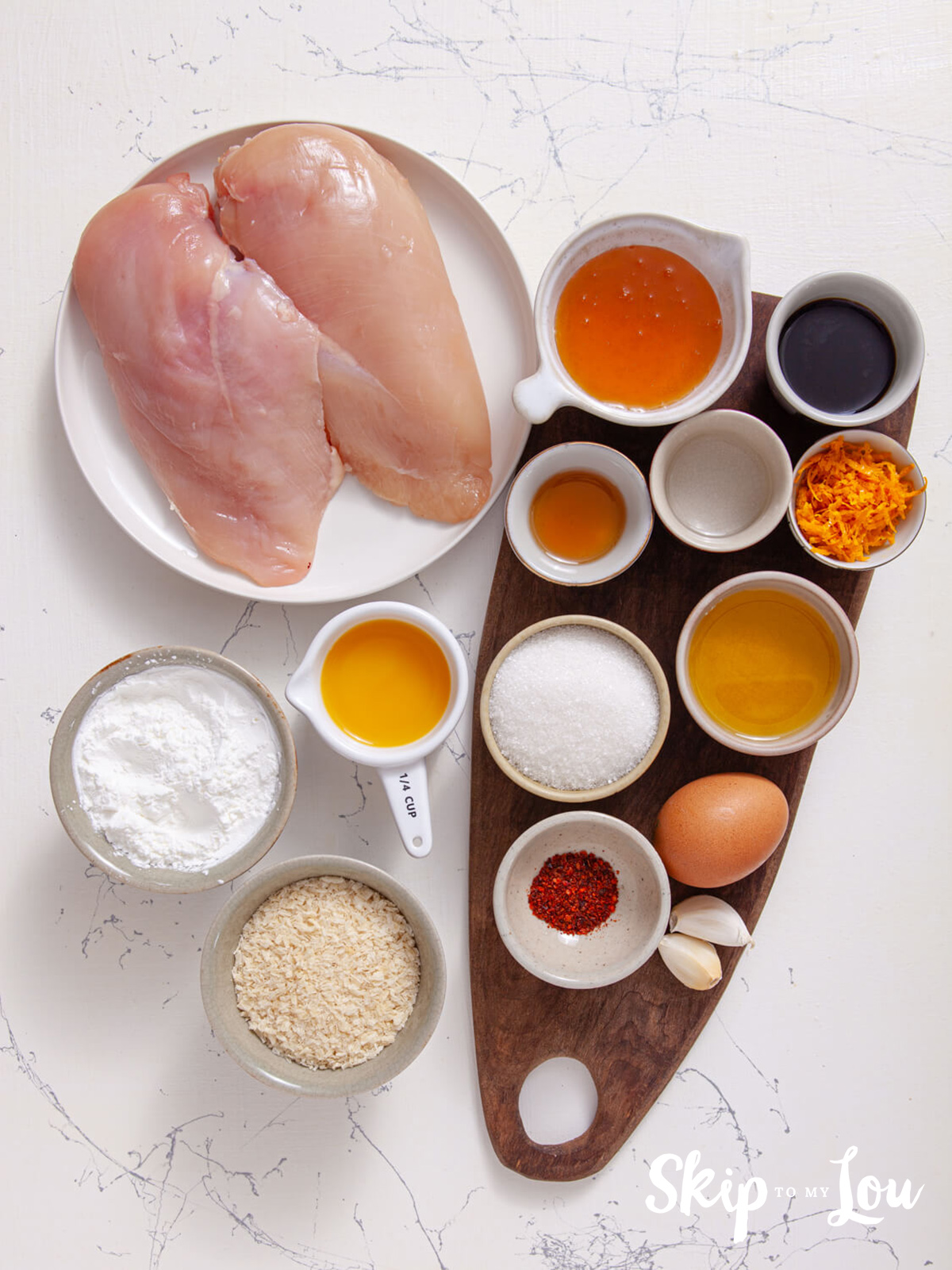 Easy baked chicken ingredients including chicken, corn flour, sauces, eggs and garlic. 