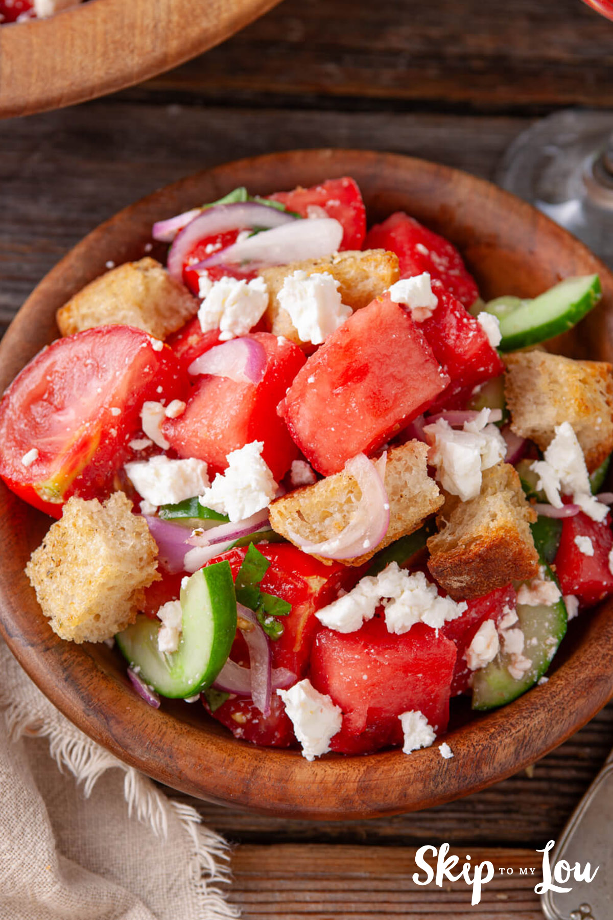 watermelon panzanella salad in a wooden bowl