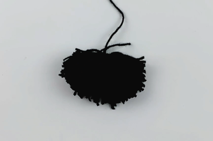 The pom pom after the trimming is completed.