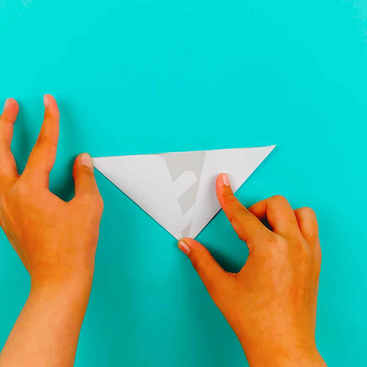fold again so snowflake cutting guide shows
