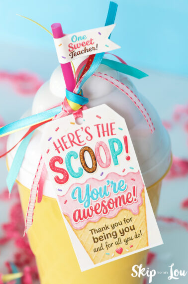 Close-up of printable Here’s the Scoop teacher appreciation tag tied to an ice cream cup with ribbons.