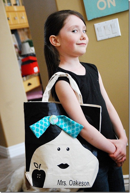 girl wearing a cute diy teacher top darling face personalize with teacher name